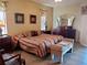 Cozy bedroom featuring comfortable furnishings, neutral walls, and classic decor at 1057 Staley St, Port Charlotte, FL 33952