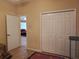 Spacious bedroom featuring neutral walls, tile floors and closet for ample storage at 1057 Staley St, Port Charlotte, FL 33952