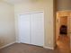 Bedroom featuring neutral walls, tile floors and closet for ample storage at 1057 Staley St, Port Charlotte, FL 33952