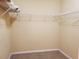 Spacious empty walk-in closet featuring tile floors and wire rack shelving at 1057 Staley St, Port Charlotte, FL 33952