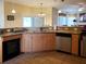 Well-appointed kitchen features granite countertops, stainless steel appliances, and ample cabinet space at 1057 Staley St, Port Charlotte, FL 33952