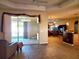 Bright living space showcases sliding glass doors, leading to the patio, and adjacent kitchen area at 1057 Staley St, Port Charlotte, FL 33952