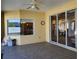 Covered porch with tile flooring and view to backyard at 1057 Staley St, Port Charlotte, FL 33952