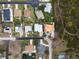 An aerial view of the home featuring a pool and surrounded by other homes in the neighborhood at 1845 Edison Dr, Englewood, FL 34224