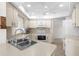 Bright kitchen features stainless steel sink, and matching white appliances at 1845 Edison Dr, Englewood, FL 34224