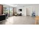 Spacious living room with tiled floors, ample natural light, and a relaxing atmosphere at 1845 Edison Dr, Englewood, FL 34224