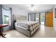Spacious main bedroom with natural light, neutral walls and tile flooring at 1845 Edison Dr, Englewood, FL 34224