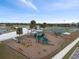 An aerial view of the playground with swings, slides, and other play equipment at 1845 Edison Dr, Englewood, FL 34224