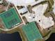 Aerial view of the park with tennis courts, a basketball court, and a skate park at 1845 Edison Dr, Englewood, FL 34224