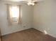 Bedroom featuring neutral walls, carpeted floors and a window with an AC unit at 2488 Warne St, Port Charlotte, FL 33952