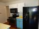 Kitchen featuring stainless steel oven and black refrigerator at 2488 Warne St, Port Charlotte, FL 33952