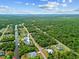 Gorgeous aerial view of a waterfront property with lush landscaping, and a private dock at 472 Eppinger Dr, Port Charlotte, FL 33953