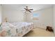 A bedroom with carpeted floors, a ceiling fan and a large window at 472 Eppinger Dr, Port Charlotte, FL 33953