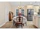 A formal dining room with modern appliances, a chandelier and french doors at 472 Eppinger Dr, Port Charlotte, FL 33953