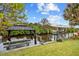 Idyllic waterfront setting with dock, gazebo, and boat lift at 472 Eppinger Dr, Port Charlotte, FL 33953