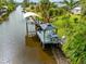 A dock on the canal with a gazebo and a boat lift at 472 Eppinger Dr, Port Charlotte, FL 33953