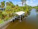 Picturesque view of a private boat dock on the canal at 472 Eppinger Dr, Port Charlotte, FL 33953