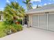 Charming home with lush landscaping and a side entry garage at 472 Eppinger Dr, Port Charlotte, FL 33953