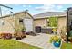 View of the exterior features a small storage building along with a patio area and landscaping at 472 Eppinger Dr, Port Charlotte, FL 33953