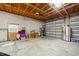 A garage with a high ceiling, storage and garage doors at 472 Eppinger Dr, Port Charlotte, FL 33953