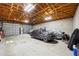 A garage with a high ceiling, cement walls, and storage at 472 Eppinger Dr, Port Charlotte, FL 33953