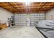 A garage with a high ceiling, storage and dual garage doors at 472 Eppinger Dr, Port Charlotte, FL 33953