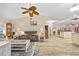 Spacious living room with wood floors and view of the kitchen and dining area at 472 Eppinger Dr, Port Charlotte, FL 33953