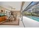 Dining area adjacent to pool, and screened-in porch at 472 Eppinger Dr, Port Charlotte, FL 33953