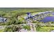 Highlighted building showcasing lush landscaping, water views, and modern condominium buildings at 14091 Heritage Landing Blvd # 121, Punta Gorda, FL 33955
