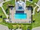 Aerial view of the community pool and surrounding lounging area at 14091 Heritage Landing Blvd # 121, Punta Gorda, FL 33955