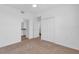 Spacious bedroom with carpet, featuring closet and en-suite bath access, enhanced by neutral tones at 14091 Heritage Landing Blvd # 121, Punta Gorda, FL 33955
