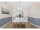 This dining room features tile flooring and a large white table, perfect for hosting dinner parties at 14091 Heritage Landing Blvd # 121, Punta Gorda, FL 33955