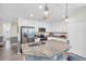 Bright kitchen features white cabinets, granite countertops, stainless steel appliances, and decorative pendant lights at 14091 Heritage Landing Blvd # 121, Punta Gorda, FL 33955