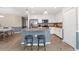 Modern kitchen with granite countertops, stainless steel appliances, pendant lighting, and a breakfast bar at 14091 Heritage Landing Blvd # 121, Punta Gorda, FL 33955