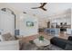 Open-concept living and kitchen area boasts a shiplap wall, tiled floors, and stainless steel appliances at 14091 Heritage Landing Blvd # 121, Punta Gorda, FL 33955