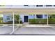 The covered parking area is located near the condo building with landscaped surroundings at 14091 Heritage Landing Blvd # 121, Punta Gorda, FL 33955