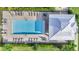 Aerial view of a luxurious community pool with plenty of lounge chairs and covered seating areas at 14091 Heritage Landing Blvd # 121, Punta Gorda, FL 33955