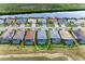 Aerial view of homes with pools and a lake in a desirable community at 15169 Spanish Point Dr, Port Charlotte, FL 33981