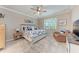 Relaxing bedroom with a king bed, large window, and comfortable seating area at 15169 Spanish Point Dr, Port Charlotte, FL 33981