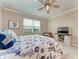 Comfortable bedroom featuring a queen bed, TV, and large window with a view at 15169 Spanish Point Dr, Port Charlotte, FL 33981