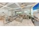 Spacious living room featuring coffered ceilings, stylish furnishings, and a view of the pool area at 15169 Spanish Point Dr, Port Charlotte, FL 33981