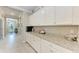 Pantry with ample storage space and granite countertops at 15169 Spanish Point Dr, Port Charlotte, FL 33981