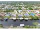Aerial view of waterfront homes on a canal, each with private docks and lush landscaping at 18305 Wolbrette Cir, Port Charlotte, FL 33948