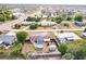 This aerial view showcases the property with a pool, shed, and trampoline, all within a fenced yard at 21354 Austin Ave, Port Charlotte, FL 33952