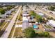 This aerial view showcases the property with a pool, shed, and trampoline, all within a fenced yard at 21354 Austin Ave, Port Charlotte, FL 33952