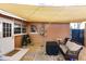 Cozy back patio with shade cover features pavers, pebble, seating area, and BBQ at 21354 Austin Ave, Port Charlotte, FL 33952