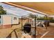 The backyard features a shed, pool, and shaded grilling area, offering great outdoor living at 21354 Austin Ave, Port Charlotte, FL 33952