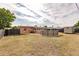 Large backyard includes pool, shed, grilling area, and well-maintained landscaping at 21354 Austin Ave, Port Charlotte, FL 33952