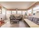 Bright sunroom featuring cozy seating, plenty of natural light, and coastal décor at 21354 Austin Ave, Port Charlotte, FL 33952
