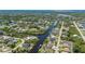 Aerial view of community highlighting waterfront homes and surrounding waterways at 4122 Library St, Port Charlotte, FL 33948